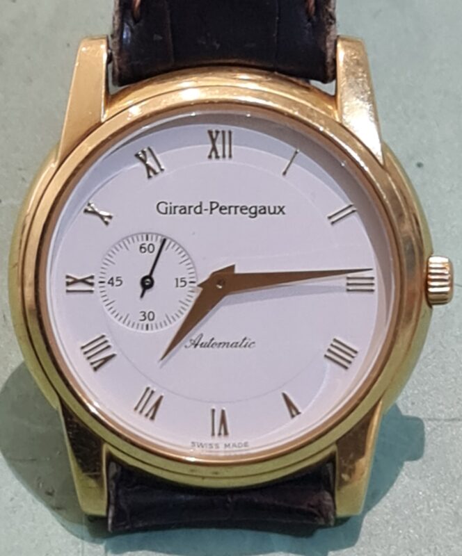 kapot horloge girard-perregaux